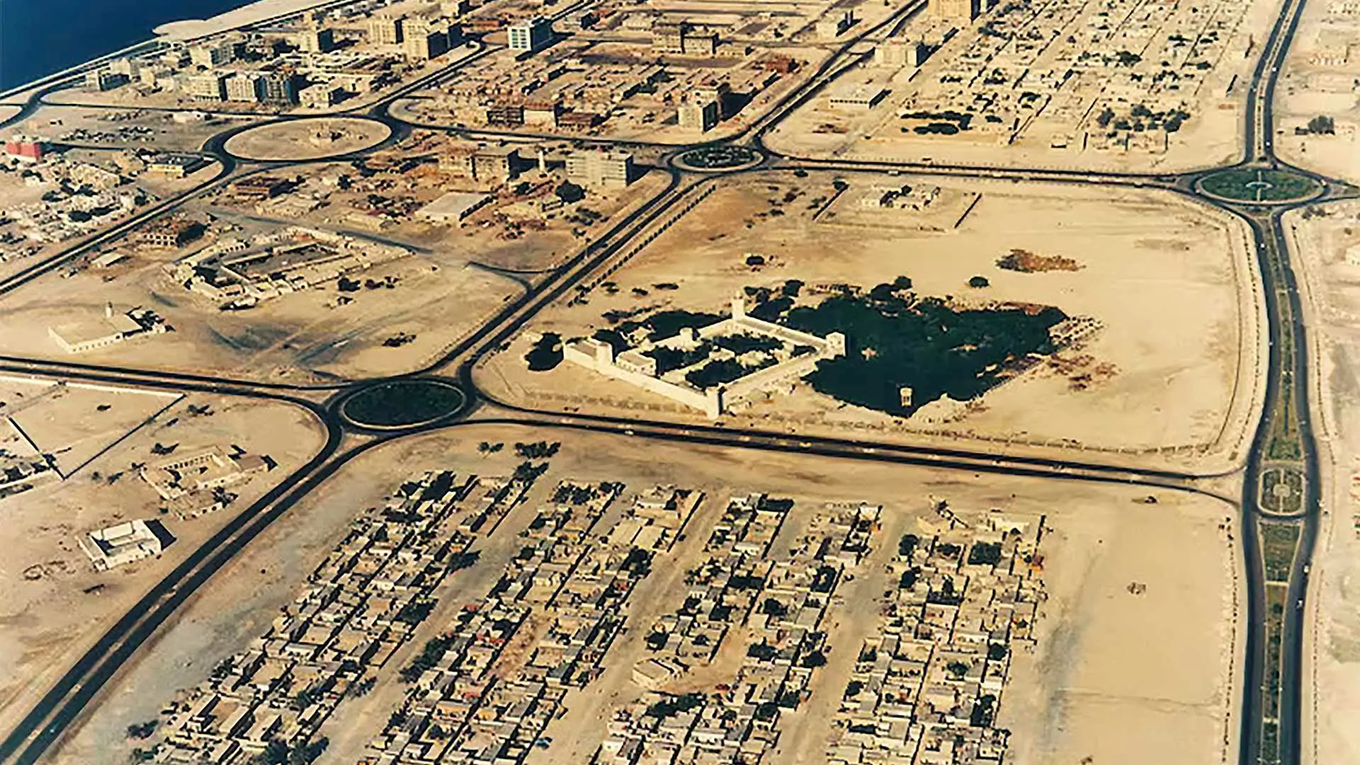 1980s — A Capital Takes Shape
Abu Dhabi's Corniche transformed into one of the Arab world's most ambitious urban waterfronts — new infrastructure, new skyline, and a city declaring its place on the world stage. Ras Al Akhdar watched it all from the water's edge.